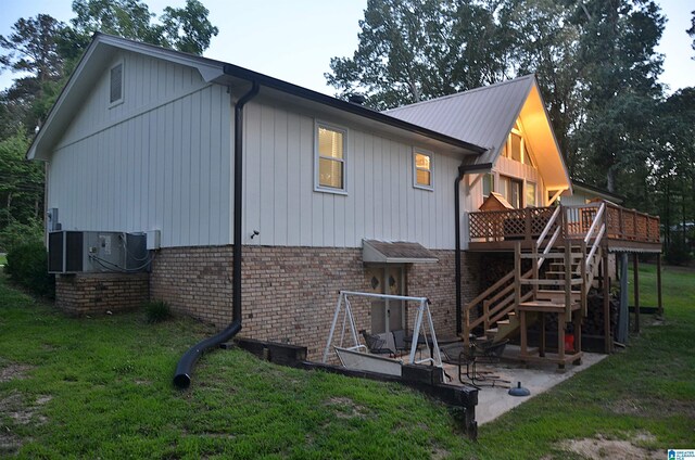 1679 Curry Hwy, Jasper, AL 35503 - rear view of house with brick siding, stairs, a lawn, a patio, and a deck