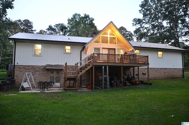 1679 Curry Hwy, Jasper, AL 35503 - back of house featuring stairway, a deck, a lawn, brick siding, and a patio
