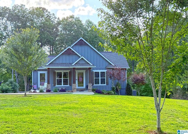 171 Sweetwater Dr, Wedowee, AL 36278 - craftsman-style house featuring a front lawn, covered porch, and board and batten siding