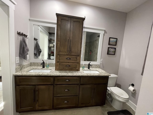 171 Sweetwater Dr, Wedowee, AL 36278 - full bathroom with double vanity, toilet, baseboards, a shower, and tile patterned floors