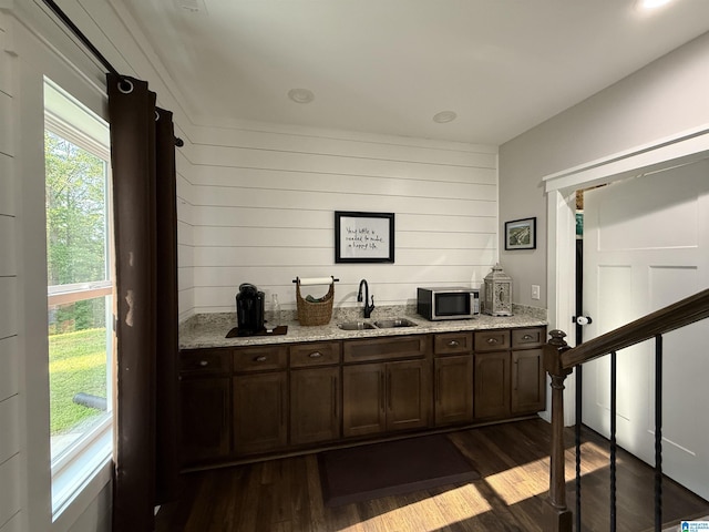 171 Sweetwater Dr, Wedowee, AL 36278 - indoor wet bar featuring dark wood-style floors, stainless steel microwave, and wood walls