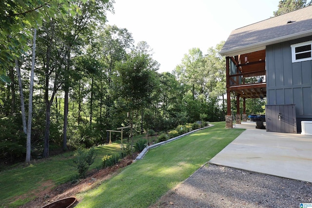 171 Sweetwater Dr, Wedowee, AL 36278 - view of grassy yard with a patio area and view of scattered trees