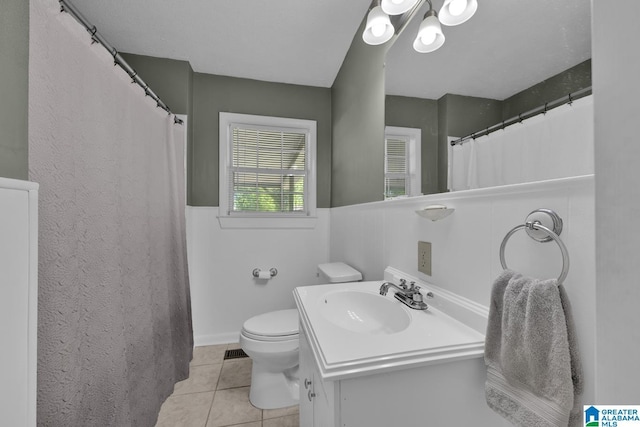 1416 11th St SE, Cullman, AL 35055 - bathroom featuring toilet, vanity, tile patterned floors, a chandelier, and a shower with shower curtain