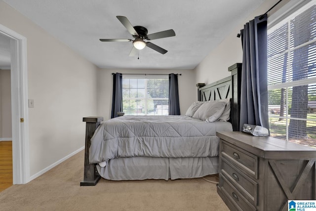 1416 11th St SE, Cullman, AL 35055 - bedroom with carpet, baseboards, and ceiling fan