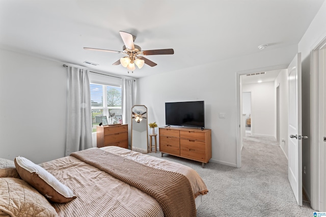 1063 Archers Trl E, Springville, AL 35146 - bedroom featuring light colored carpet, a ceiling fan, and baseboards