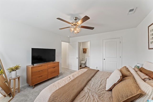 1063 Archers Trl E, Springville, AL 35146 - bedroom with light carpet, ensuite bath, baseboards, and a ceiling fan