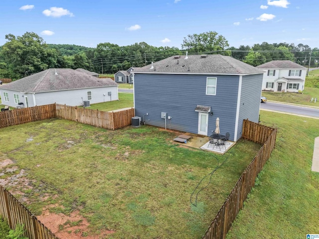1063 Archers Trl E, Springville, AL 35146 - back of property with a patio and central air condition unit