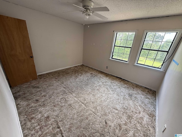 1528 Rainbow Ln, Warrior, AL 35180 - carpeted empty room with a ceiling fan and a textured ceiling