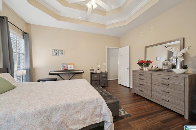 2093 Forest Lakes Ln, Sterrett, AL 35147 - bedroom featuring ornamental molding, dark wood-type flooring, a tray ceiling, and a ceiling fan