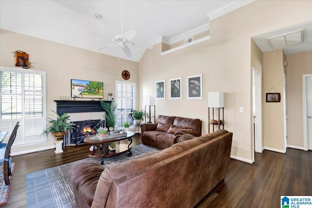 2093 Forest Lakes Ln, Sterrett, AL 35147 - living area with dark wood-style floors, baseboards, a ceiling fan, a warm lit fireplace, and ornamental molding