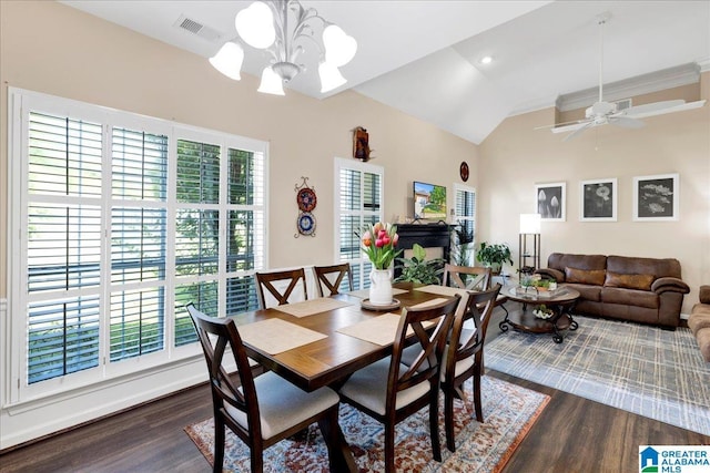 2093 Forest Lakes Ln, Sterrett, AL 35147 - dining area with dark wood finished floors, a chandelier, lofted ceiling, and a ceiling fan