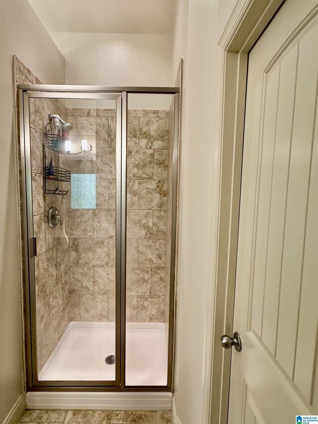 567 Brookwater Way, Wedowee, AL 36278 - bathroom with baseboards and a stall shower