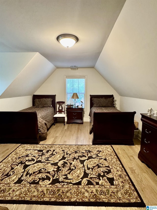 567 Brookwater Way, Wedowee, AL 36278 - bedroom with wood finished floors and vaulted ceiling