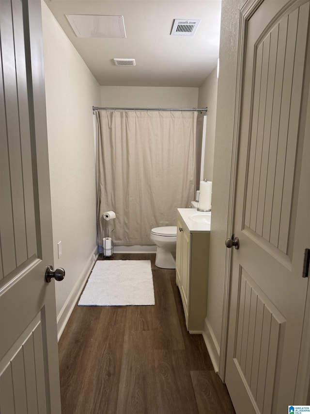567 Brookwater Way, Wedowee, AL 36278 - full bathroom with wood finished floors, toilet, vanity, baseboards, and a shower with curtain