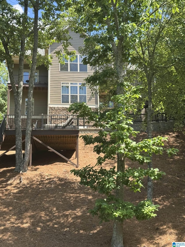 567 Brookwater Way, Wedowee, AL 36278 - view of property exterior with a balcony and stone siding