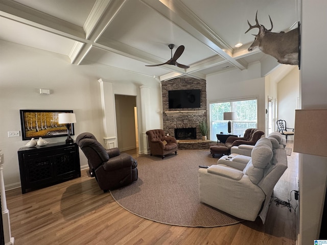 567 Brookwater Way, Wedowee, AL 36278 - living room with coffered ceiling, ceiling fan, a stone fireplace, beamed ceiling, and wood finished floors