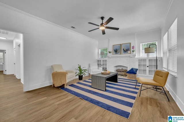 1119 8th Ave W, Birmingham, AL 35204 - living area featuring wood finished floors, baseboards, ornamental molding, and a ceiling fan