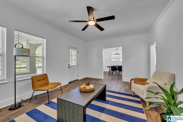 1119 8th Ave W, Birmingham, AL 35204 - living area with wood finished floors, ornamental molding, a ceiling fan, baseboards, and a chandelier
