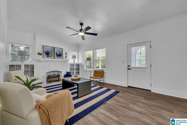 1119 8th Ave W, Birmingham, AL 35204 - living room with a fireplace, ornamental molding, a ceiling fan, wood finished floors, and baseboards
