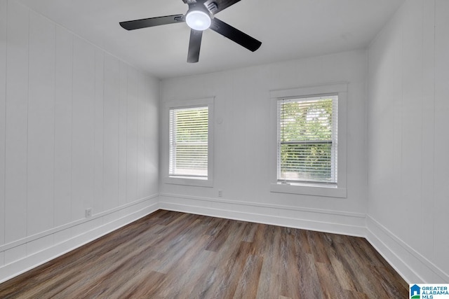 1119 8th Ave W, Birmingham, AL 35204 - empty room featuring dark wood-type flooring, baseboards, and a ceiling fan