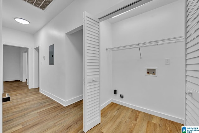 1119 8th Ave W, Birmingham, AL 35204 - washroom featuring light wood-type flooring, electric panel, washer hookup, and baseboards