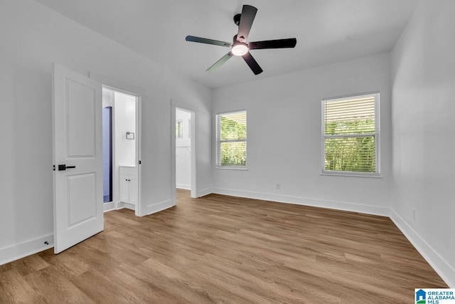 1119 8th Ave W, Birmingham, AL 35204 - empty room with light wood-style flooring, a ceiling fan, and baseboards