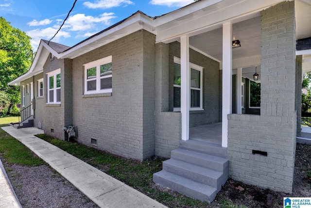 1119 8th Ave W, Birmingham, AL 35204 - view of side of property featuring crawl space, a porch, entry steps, and brick siding