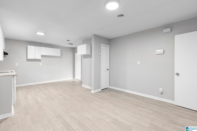 1232 Frisco St, Birmingham, AL 35224 - finished below grade area with light wood-style flooring and baseboards