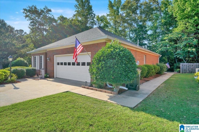 617 Golden Eagle Cir, Jasper, AL 35504 - view of home's exterior featuring brick siding, a lawn, an attached garage, and driveway