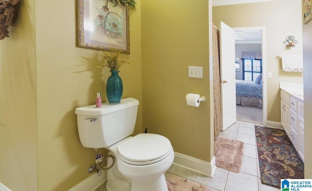 617 Golden Eagle Cir, Jasper, AL 35504 - ensuite bathroom featuring toilet, vanity, tile patterned flooring, and baseboards