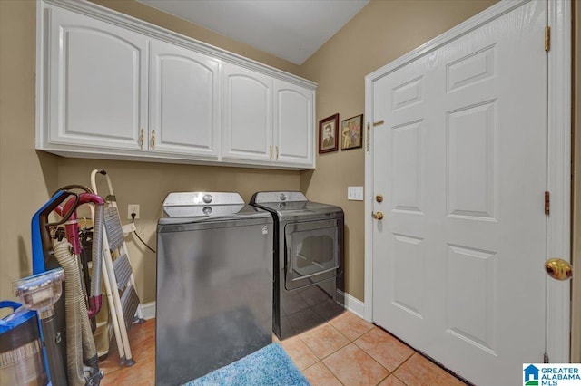 617 Golden Eagle Cir, Jasper, AL 35504 - laundry room with cabinet space, washing machine and dryer, light tile patterned flooring, and baseboards