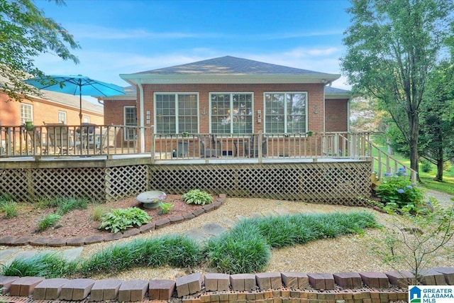 617 Golden Eagle Cir, Jasper, AL 35504 - back of property featuring a wooden deck and brick siding