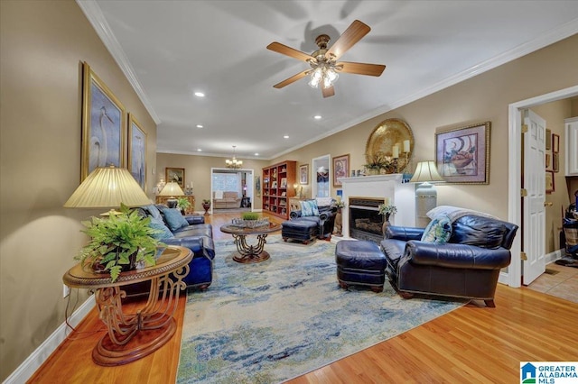 617 Golden Eagle Cir, Jasper, AL 35504 - living area featuring a fireplace, wood finished floors, crown molding, ceiling fan, and recessed lighting