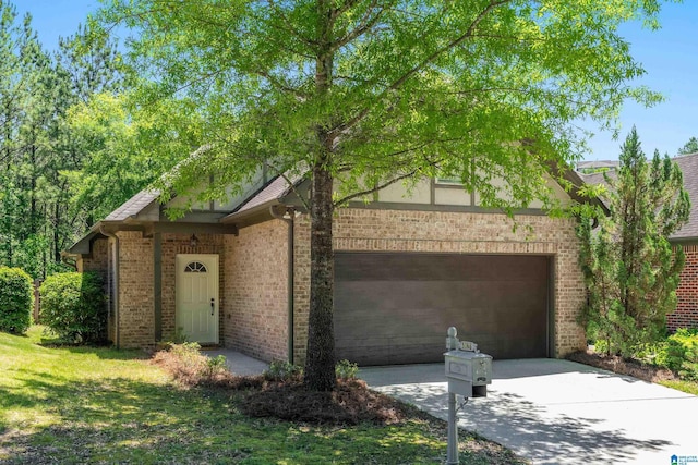 5846 Water Branch Rd, Hoover, AL 35244 - view of front of house featuring a garage, driveway, and brick siding