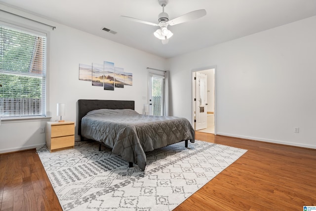 5846 Water Branch Rd, Hoover, AL 35244 - bedroom with wood finished floors, baseboards, a ceiling fan, and ensuite bathroom