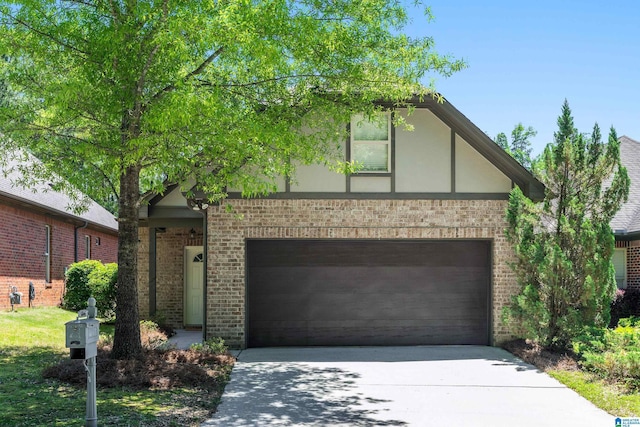 5846 Water Branch Rd, Hoover, AL 35244 - view of front of home featuring concrete driveway, brick siding, and stucco siding