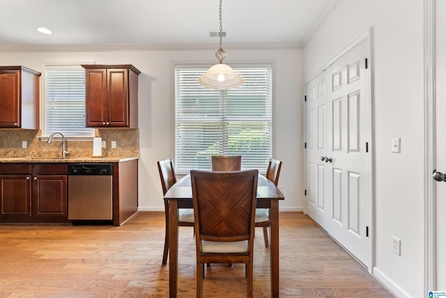 5846 Water Branch Rd, Hoover, AL 35244 - dining area with ornamental molding, light wood finished floors, plenty of natural light, and baseboards