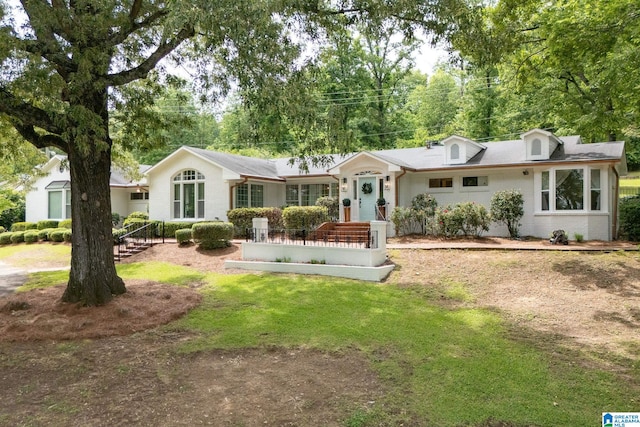 3208 N Woodridge Rd, Mountain Brook, AL 35223 - view of front of home with a front lawn and brick siding