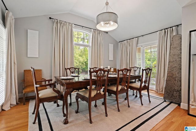 3208 N Woodridge Rd, Mountain Brook, AL 35223 - dining room with vaulted ceiling, light wood-type flooring, and healthy amount of natural light