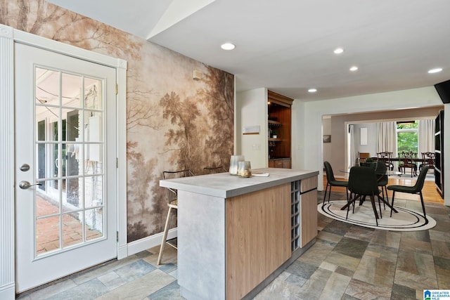 3208 N Woodridge Rd, Mountain Brook, AL 35223 - kitchen featuring recessed lighting, light brown cabinetry, a kitchen island, light countertops, and modern cabinets