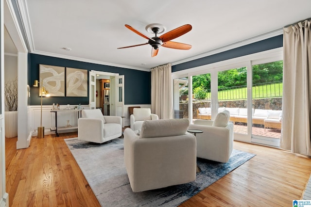 3208 N Woodridge Rd, Mountain Brook, AL 35223 - living area featuring ornamental molding, a ceiling fan, light wood-type flooring, and a wainscoted wall