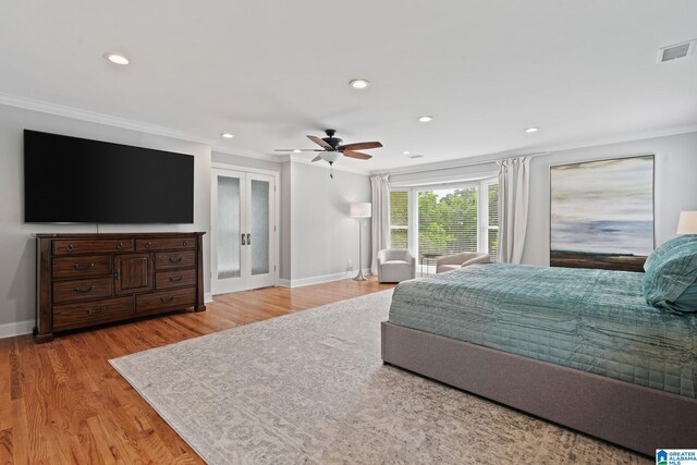 3208 N Woodridge Rd, Mountain Brook, AL 35223 - bedroom featuring crown molding, french doors, baseboards, recessed lighting, and light wood-style floors