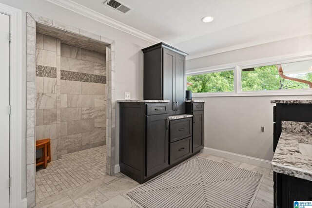 3208 N Woodridge Rd, Mountain Brook, AL 35223 - bathroom with vanity, a walk in shower, crown molding, recessed lighting, and baseboards