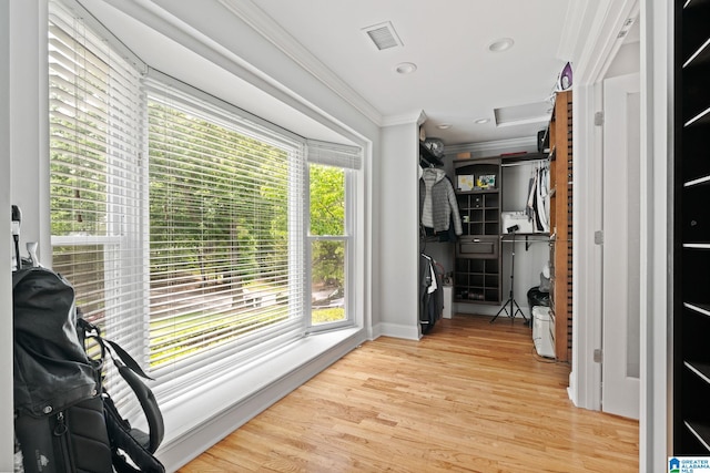 3208 N Woodridge Rd, Mountain Brook, AL 35223 - hallway featuring ornamental molding, attic access, wood finished floors, and baseboards