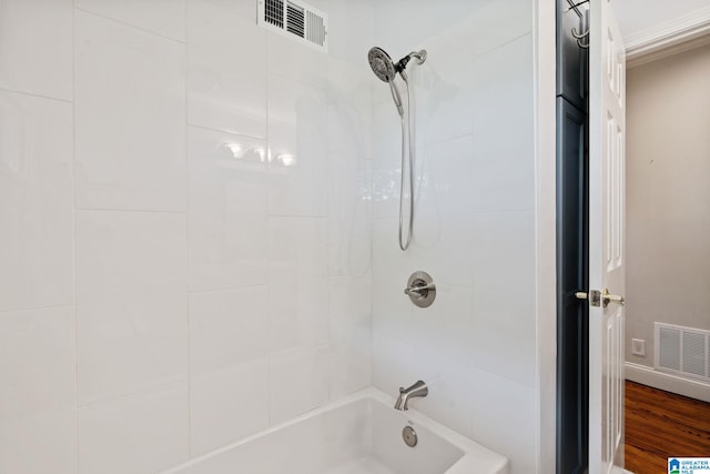 3208 N Woodridge Rd, Mountain Brook, AL 35223 - full bath featuring wood finished floors and shower / washtub combination