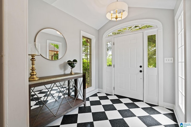 3208 N Woodridge Rd, Mountain Brook, AL 35223 - entrance foyer with tile patterned floors, baseboards, and vaulted ceiling