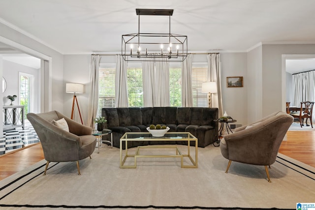 3208 N Woodridge Rd, Mountain Brook, AL 35223 - living area featuring a chandelier, wood finished floors, plenty of natural light, and crown molding