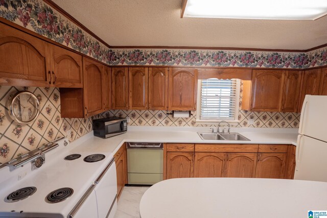 3332 Berry Dr, Hueytown, AL 35023 - kitchen with white appliances, a sink, light countertops, brown cabinets, and ornamental molding