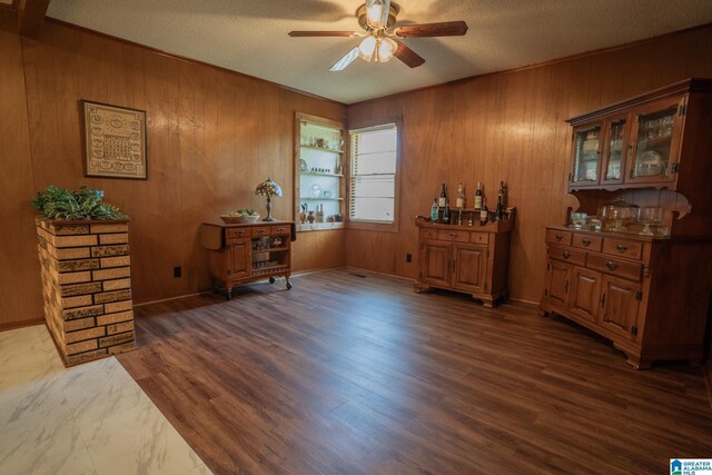 3332 Berry Dr, Hueytown, AL 35023 - office area with wooden walls, a ceiling fan, and a textured ceiling