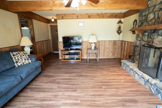 3332 Berry Dr, Hueytown, AL 35023 - living area with a ceiling fan, beamed ceiling, a wainscoted wall, wood finished floors, and wood walls